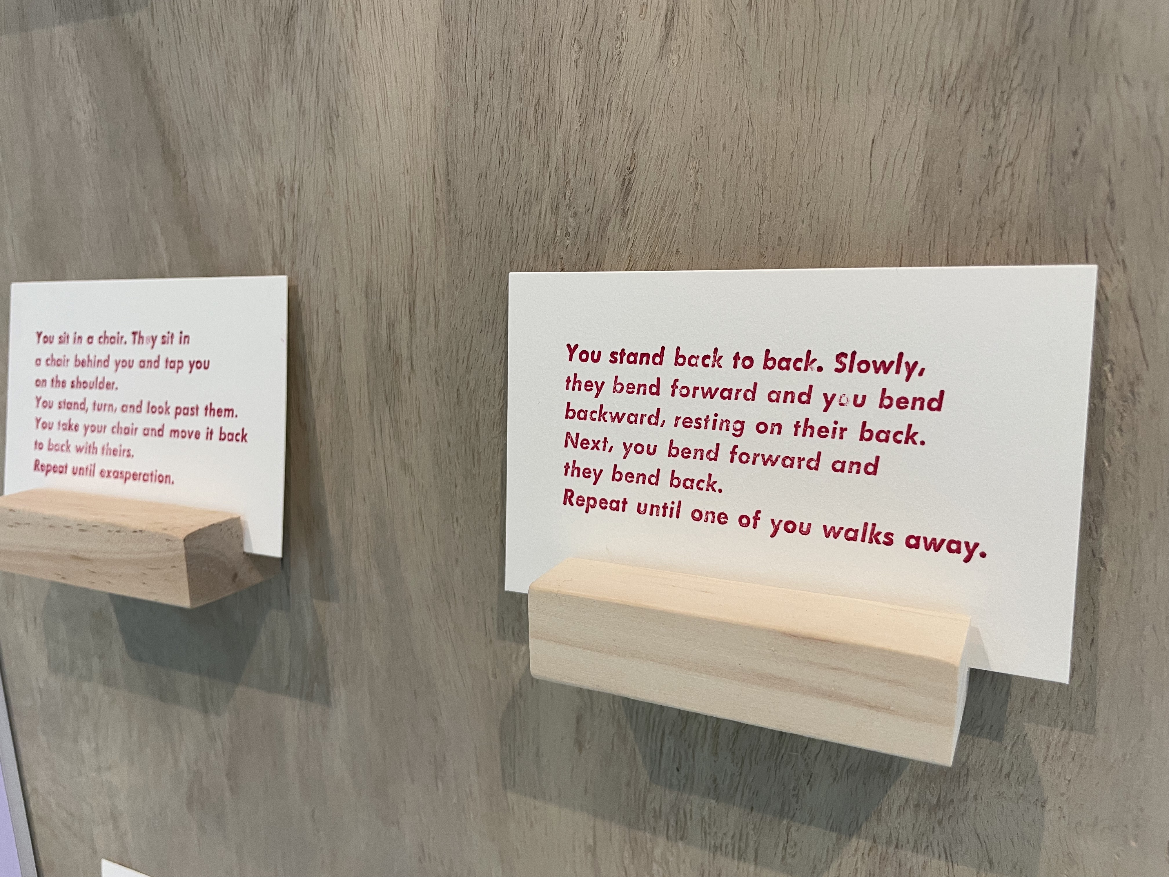 a close up of a card that gives instructions to viewers about going back to back and sharing moments of support on each other