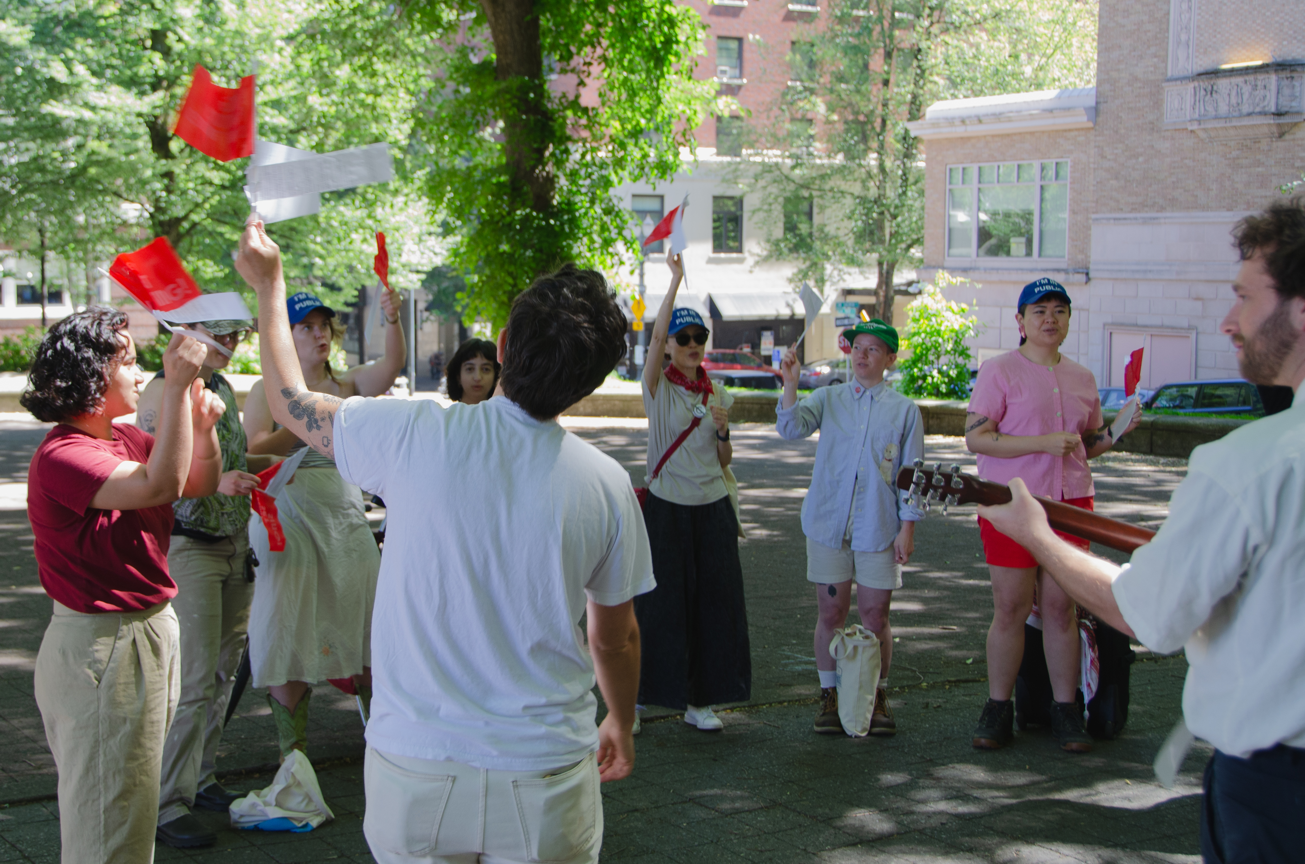 a group of people wave flags in the air